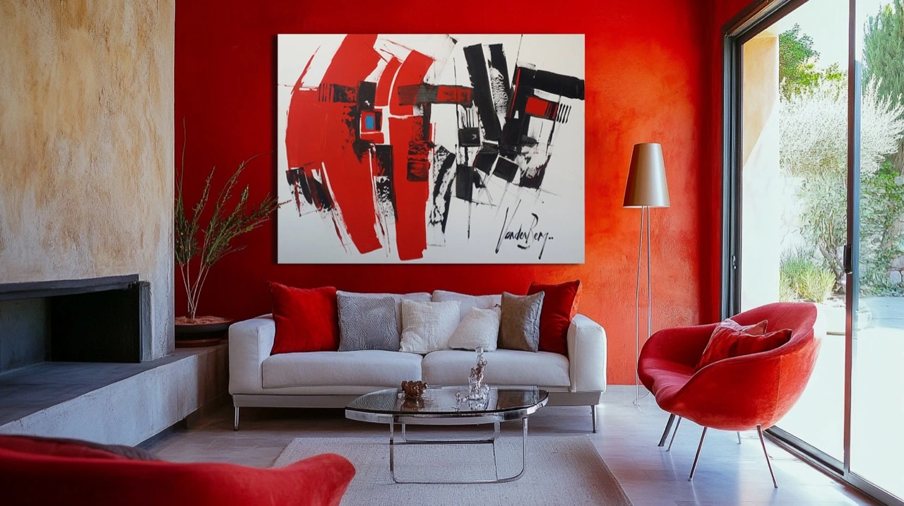 A red, black and white painting above a pale sofa in a red-walled living room